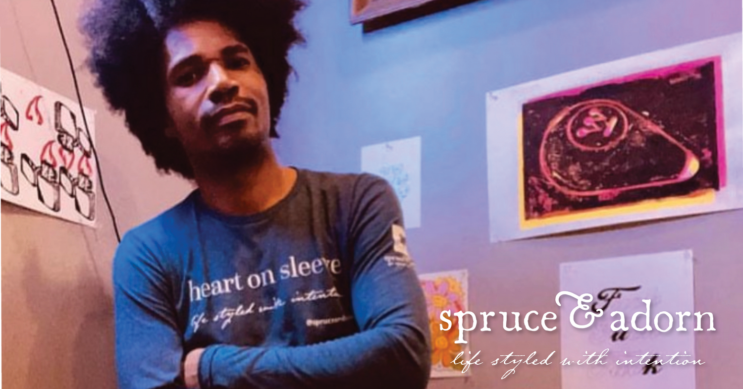 Electronic Musician Buscrates, based in Pittsburgh, Pa, plays a dj set on Twitch wearing his light-weight positive affirmation apparel “heart on sleeve” crew-neck long-sleeve shirt. He is rocking our non-bianary affirmation apparel for positive vibes. Rocking it out in an ambient studio — life styled with intention™ at spruce & adorn™