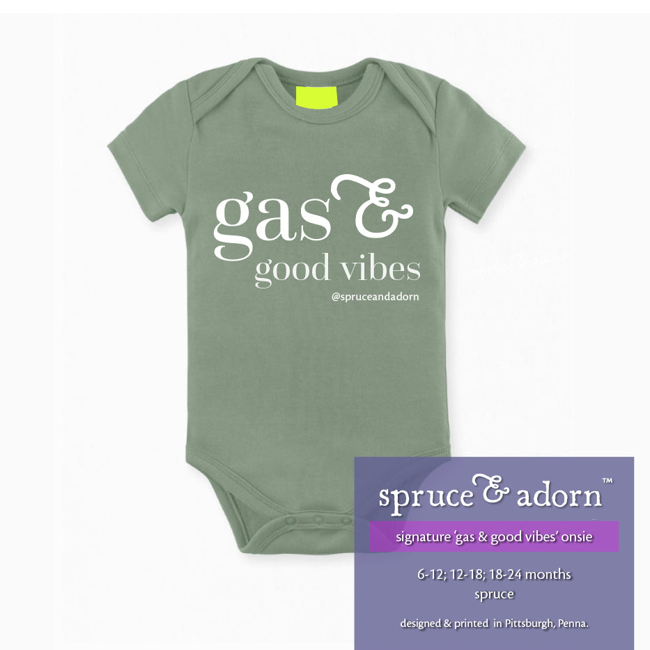 periwinkle description box, overlying spruce green baby onsie, reading :  spruce & adorn, signature ‘gas & good vibes’ onsie, 6-12, 12-24, 18-24 months, color spruce with a highlighter green placer for the imprinted tag reading designed & printed in Pittsburgh, Pa. over a white background 