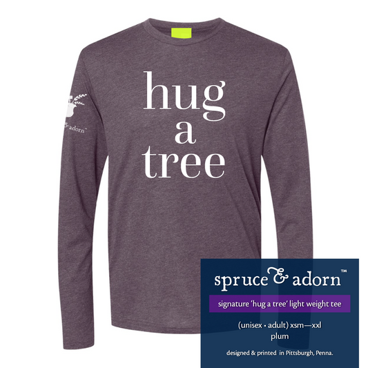 navy description box, overlying plum colored signature ‘hug a tree’ @spruceandadorn long sleeve t-shirt reading : ‘hug a tree’ light weight tee (unisex • adult) xsm-xxl plum designed & printed in Pittsburgh, Penna.