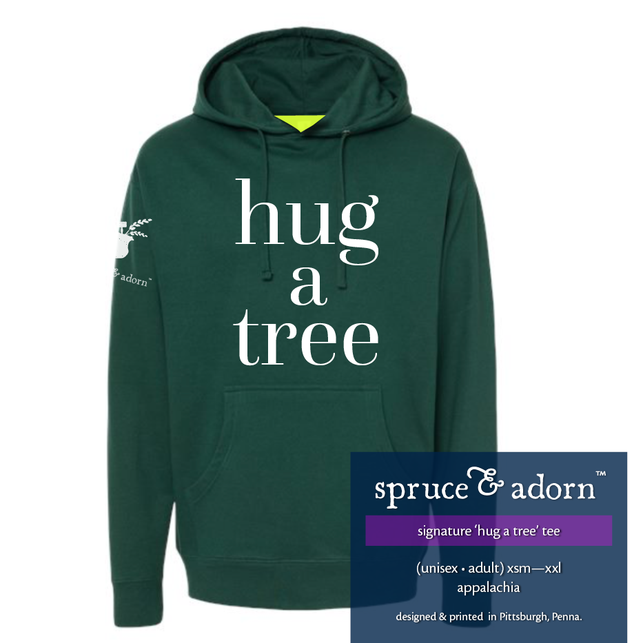 navy description box, overlying appalachia colored oversized signature ‘hug a tree’ @spruceandadorn hoodie reading : ‘hug a tree’ hoodie w/pocket’ (unisex • adult) xsm-xxl appalachia with our logo on the righ arm patch