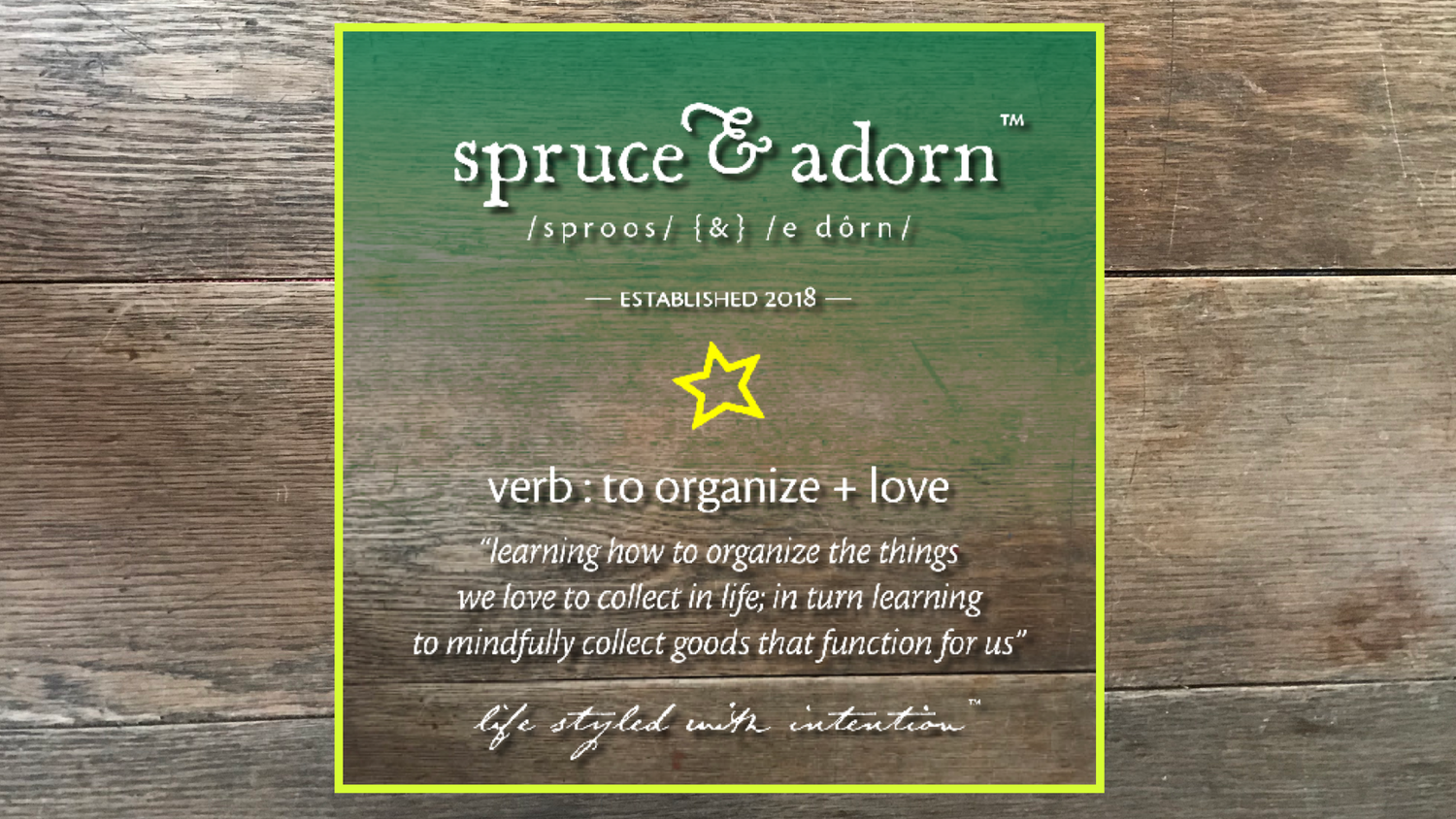 spruce & adorn logo overylaying a green gradient + wooden background reading "learning hour to organize the things we love to collect in life; in turn learning to mindfully collect goods that function for us" life styled with intention™